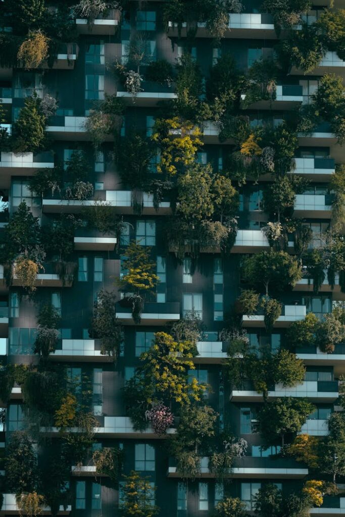 Modern residential building facade decorated with green plants